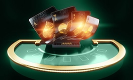 black baccarat cards placed on a casino table